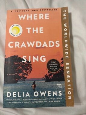 Where the Crawdads Sing paperback by Delia Owens - Orange/Blue cover